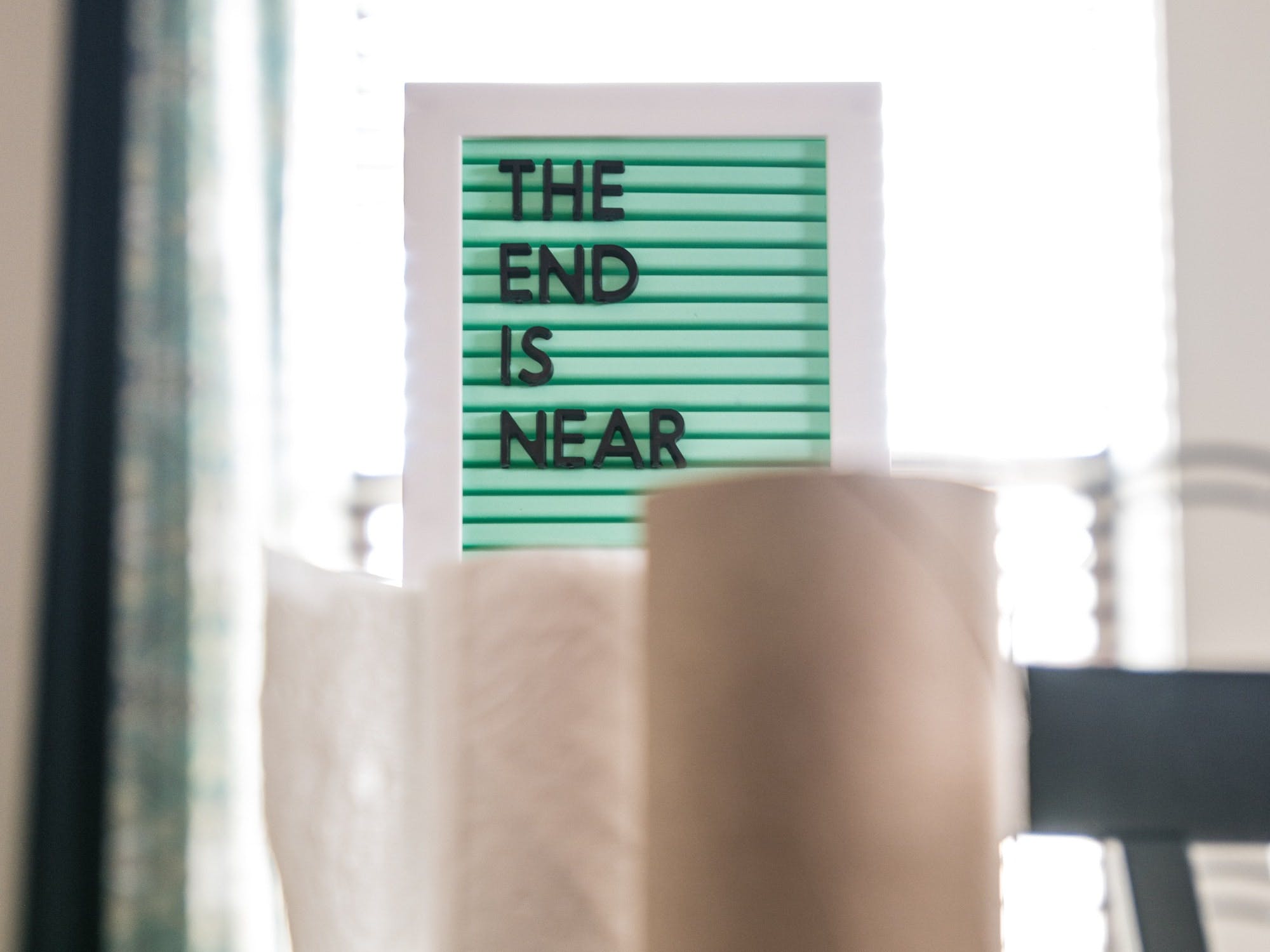 roll of paper towels in front of sign