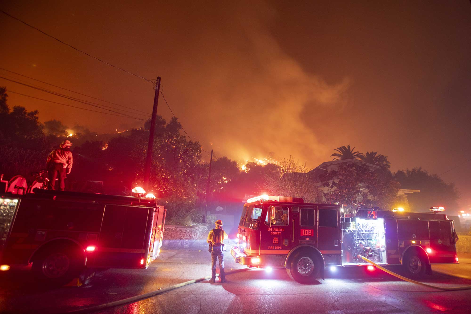 Firefighters battle the Eaton fire as it burns in the Sierra Madre, east side of Los Angeles, California.
