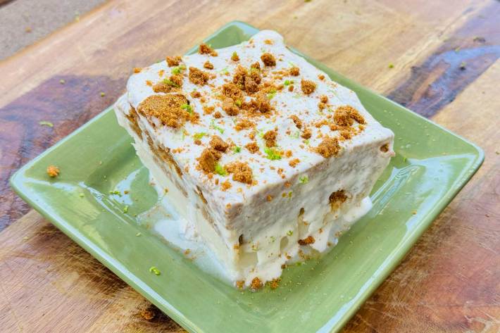 a square of key lime pie icebox cake on a green plate