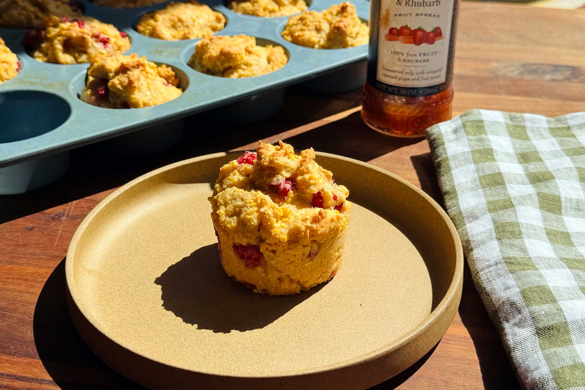 nondairy corn muffin with berries on plate