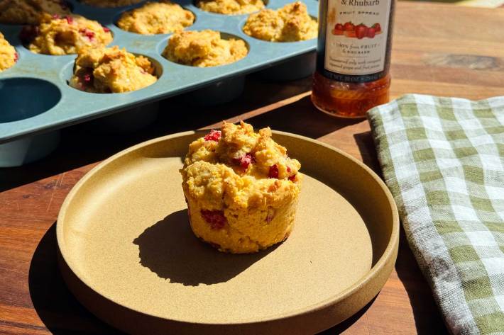 nondairy corn muffin with berries on plate