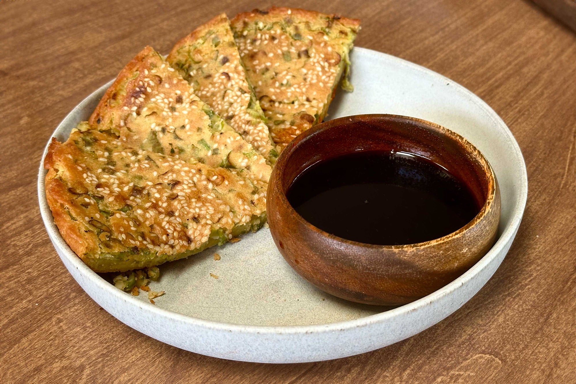 sesame scallion socca with sauce