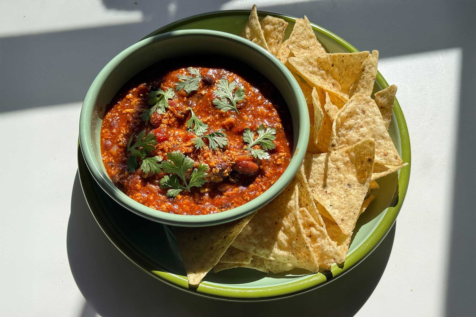 bowl of tofu chili with tortilla chips