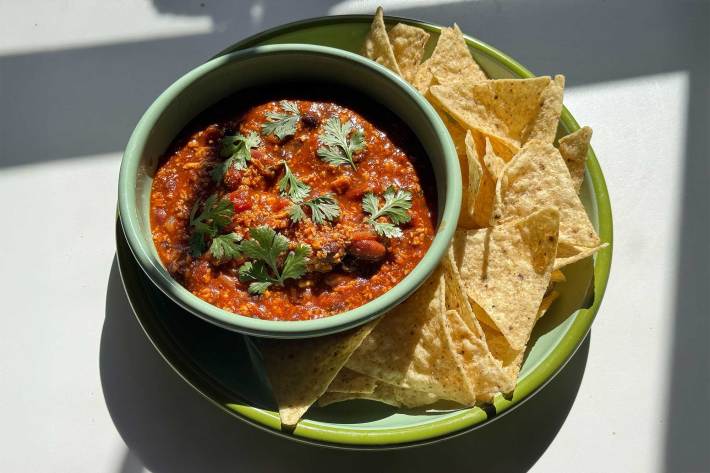 bowl of tofu chili with tortilla chips