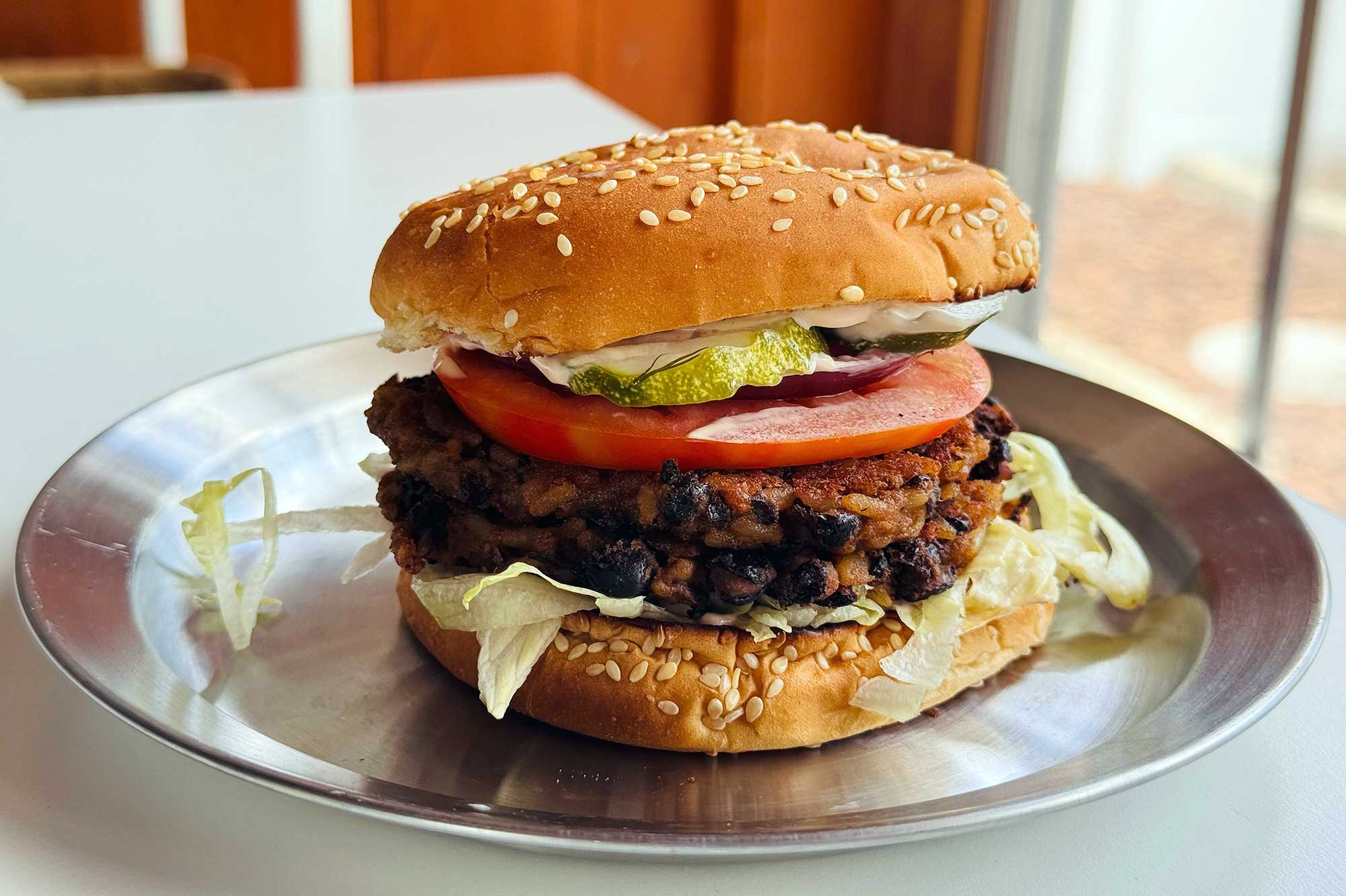 black bean smash burger on bun on plate