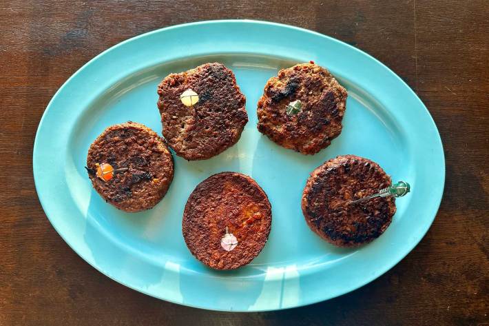 five veggie burger patties on plate