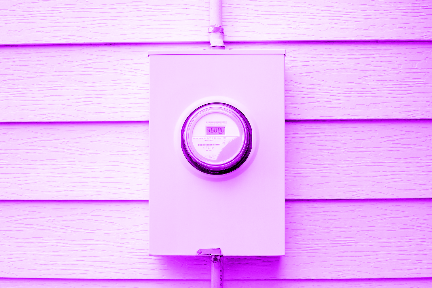 Power meter box mounted on a wall. Kilowatt-hour electric meter installed outside of a house.