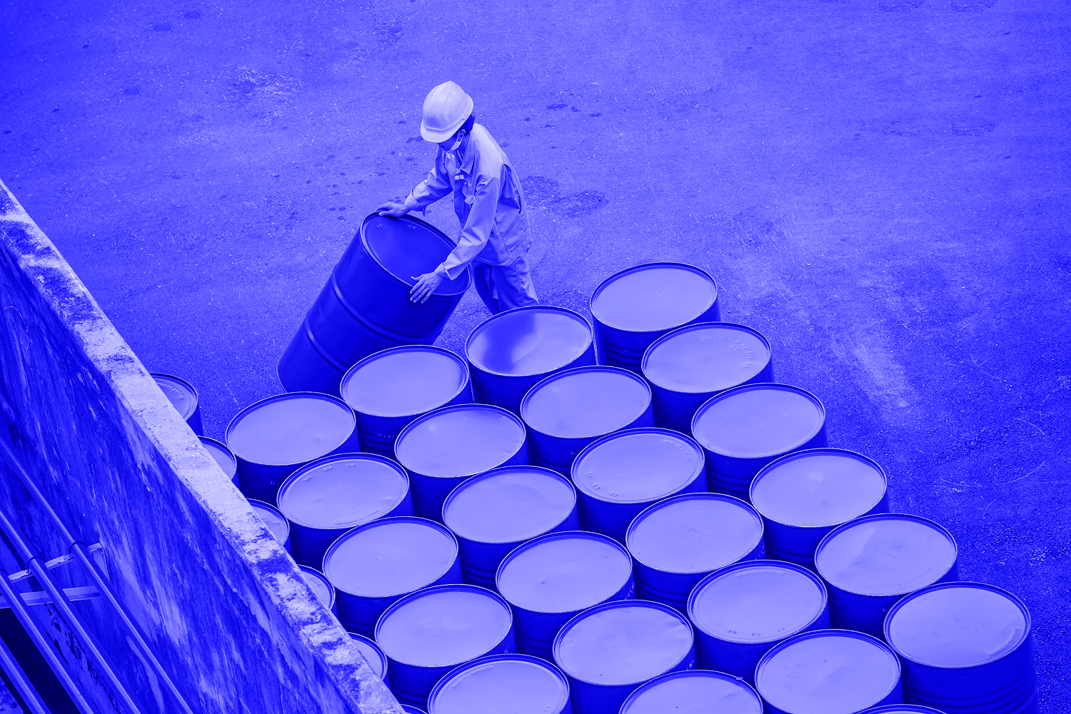 Top view oil barrels vertical move for on the male worker help