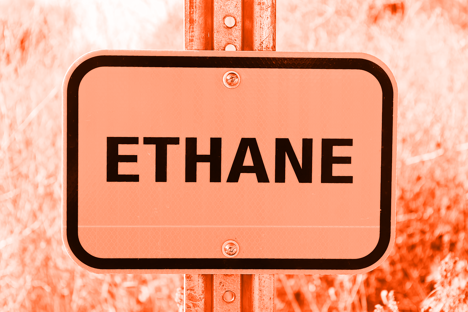 orange Ethane warning sign on a post