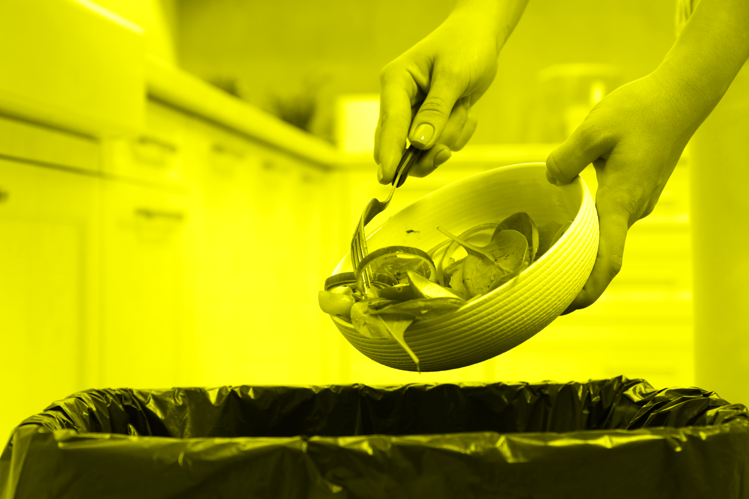 Woman scraping food into trash