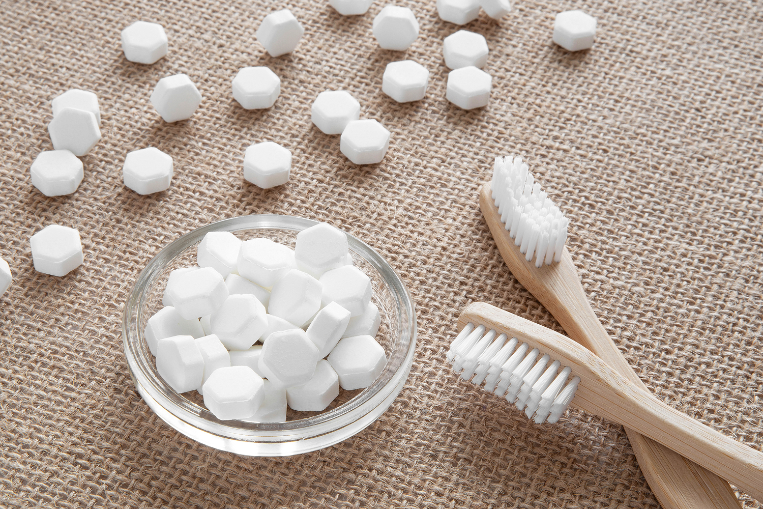 White solid toothpaste tablet with toothbrush